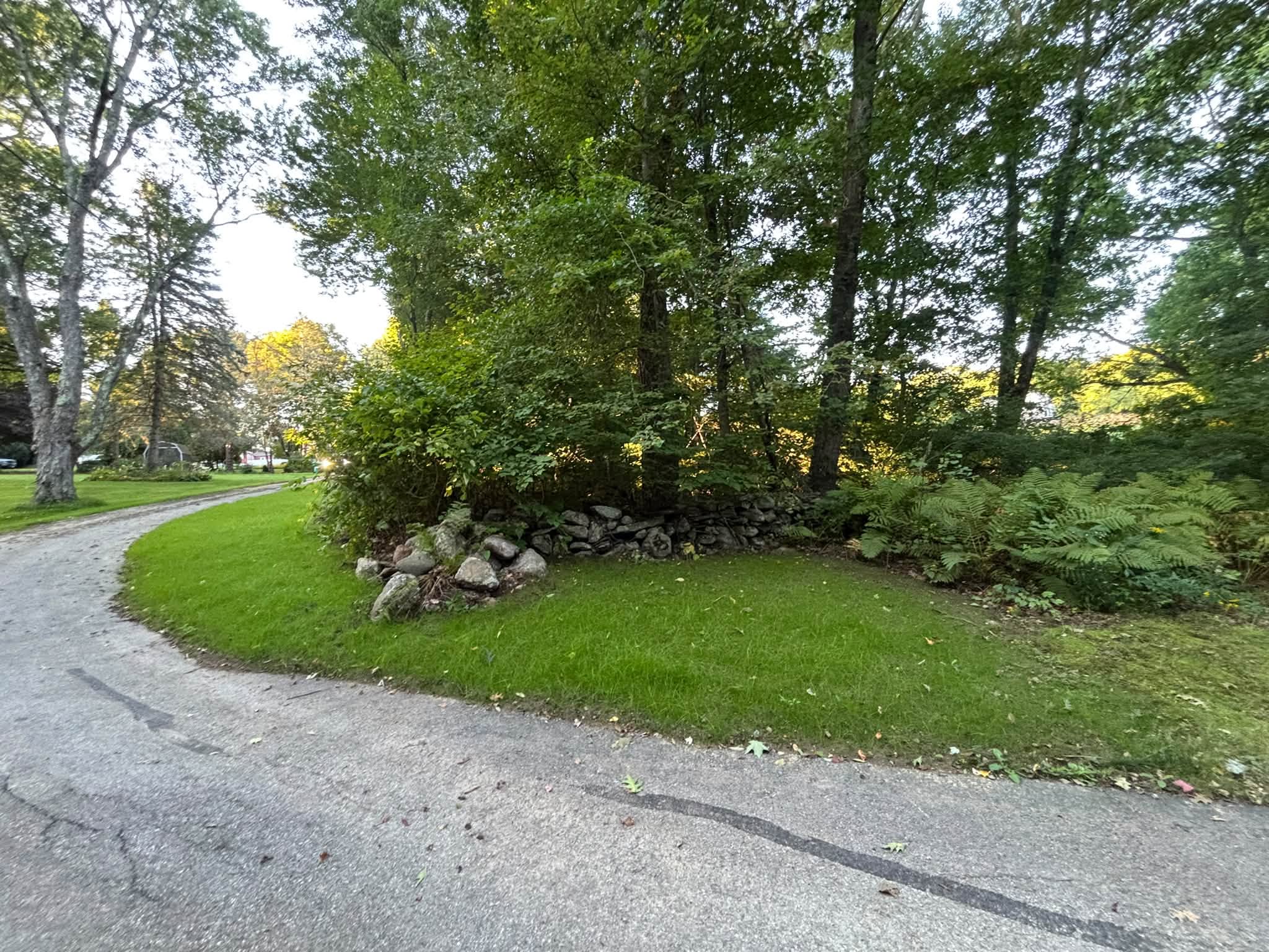 After — clean grade with mulch and loam finish, Spencer MA